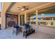 Covered patio with patio furniture and an outdoor ceiling fan at 132 E El Prado Dr, Queen Creek, AZ 85140