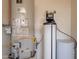 Water heater and water conditioner on concrete slab at 132 E El Prado Dr, Queen Creek, AZ 85140