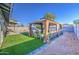 Backyard featuring artificial turf, gravel, and a gazebo with seating at 1529 W Wickieup Ln, Phoenix, AZ 85027