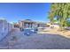 Backyard with gravel, a grill, landscaping, and gazebo with seating at 1529 W Wickieup Ln, Phoenix, AZ 85027
