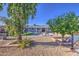 Gravel backyard showcasing landscaping, a patio, and a clear view of the home at 1529 W Wickieup Ln, Phoenix, AZ 85027