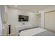 Cozy bedroom with a large TV, dresser, and bedside table for added functionality at 1529 W Wickieup Ln, Phoenix, AZ 85027