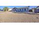 Charming single-story home with a gravel yard and a lovely floral archway entrance at 1529 W Wickieup Ln, Phoenix, AZ 85027