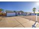Single-story home featuring an attached garage, driveway, well-kept gravel, and easy landscaping at 1529 W Wickieup Ln, Phoenix, AZ 85027