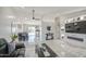 Open-concept living room with a dining table and kitchen, perfect for social gatherings at 1529 W Wickieup Ln, Phoenix, AZ 85027