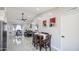 Open floor plan showcasing dining area connected to a cozy living room with modern decor and plenty of natural light at 1529 W Wickieup Ln, Phoenix, AZ 85027