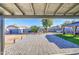 Covered patio with brick flooring, landscaping, and shaded area at 1529 W Wickieup Ln, Phoenix, AZ 85027