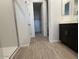 Modern bathroom with dark wood cabinets, wood look tile flooring, and walk in shower at 15773 W Beryl Ave, Waddell, AZ 85355