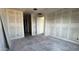 Unfinished bedroom featuring walls covered in drywall and doorway leading into an en suite at 15773 W Beryl Ave, Waddell, AZ 85355