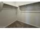 Walk in closet with clothing racks and carpet flooring at 15773 W Beryl Ave, Waddell, AZ 85355