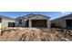 Single-story home with stucco and tile roof construction is underway at 15773 W Beryl Ave, Waddell, AZ 85355