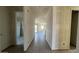 Unfinished new construction hallway with wood-look tile flooring throughout at 15773 W Beryl Ave, Waddell, AZ 85355