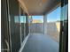 Covered patio with sliding glass doors leading to the backyard at 15773 W Beryl Ave, Waddell, AZ 85355