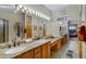 Bright bathroom features dual sinks, granite countertops, and ample cabinet space at 16450 E Ave Of The Fountains -- # 14, Fountain Hills, AZ 85268