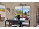 Dining area next to kitchen, featuring large windows overlooking desert landscaping at 16450 E Ave Of The Fountains -- # 14, Fountain Hills, AZ 85268