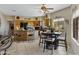 Eat-in kitchen featuring wood cabinets, granite countertops, tile flooring and an island with bar seating at 16450 E Ave Of The Fountains -- # 14, Fountain Hills, AZ 85268