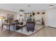 Neutral toned living room with tile accents, a ceiling fan, and built in shelving at 16450 E Ave Of The Fountains -- # 14, Fountain Hills, AZ 85268