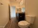 Bathroom featuring granite counters, toilet and a vanity with ample lighting at 1734 W Pollack St, Phoenix, AZ 85041