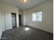 Bedroom featuring window, carpet, and closet at 1734 W Pollack St, Phoenix, AZ 85041