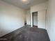 Neutral bedroom featuring sliding closet doors and plush carpeting at 1734 W Pollack St, Phoenix, AZ 85041