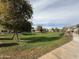 Exterior view of the community green space, showing a grassy area and playground at 1734 W Pollack St, Phoenix, AZ 85041