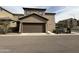 Exterior front view of a two-story home showing garage, landscaped yard and neutral color scheme at 1734 W Pollack St, Phoenix, AZ 85041