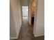 Hallway view leading to a bedroom and bathroom with granite countertops at 1734 W Pollack St, Phoenix, AZ 85041