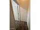 A hallway featuring wood-look floors, leading to other areas of the house at 1734 W Pollack St, Phoenix, AZ 85041