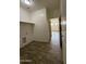 The laundry room area provides ample space for side-by-side appliances, complete with tile flooring at 1734 W Pollack St, Phoenix, AZ 85041