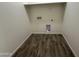 A simple laundry room equipped with washer and dryer hookups at 1734 W Pollack St, Phoenix, AZ 85041