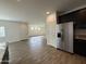 Open floor plan showcasing a seamless transition from the kitchen to the spacious, light-filled living area at 1734 W Pollack St, Phoenix, AZ 85041