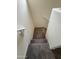 Interior view of a carpeted staircase with white walls and a white handrail at 1734 W Pollack St, Phoenix, AZ 85041
