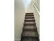 Carpeted stairs lead to the upper level, showcasing modern design and seamless transition at 1734 W Pollack St, Phoenix, AZ 85041