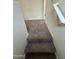 Carpeted stairs lead to the upper level, showcasing modern design and seamless transition at 1734 W Pollack St, Phoenix, AZ 85041
