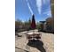 Beautiful backyard featuring a table set and desert vegetation at 17447 W Yavapai St, Goodyear, AZ 85338