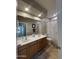 Bright bathroom with a double sink vanity and large mirror at 17447 W Yavapai St, Goodyear, AZ 85338