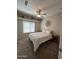 Cozy bedroom featuring a ceiling fan, window, and neutral decor at 17447 W Yavapai St, Goodyear, AZ 85338