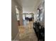 Inviting entryway with tile floors, neutral walls, and a view into the spacious living area at 17447 W Yavapai St, Goodyear, AZ 85338