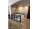 Hallway with a display cabinet, clock, and dark wood accents at 17447 W Yavapai St, Goodyear, AZ 85338