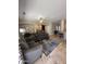 Spacious living room with travertine floors, ceiling fan, and neutral decor at 17447 W Yavapai St, Goodyear, AZ 85338