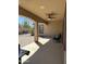 Relaxing covered patio with ceiling fan and outdoor furniture at 17447 W Yavapai St, Goodyear, AZ 85338