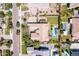 High angle view of a property boasting a pool, pergola, manicured lawn, and tennis court at 17673 E Bronco Dr, Queen Creek, AZ 85142