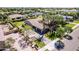 Aerial view of a home featuring a lush lawn, large driveway, three-car garage and backyard pool at 17673 E Bronco Dr, Queen Creek, AZ 85142