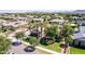 Aerial view of a home with a sparkling pool, covered patio, and mature landscaping at 17673 E Bronco Dr, Queen Creek, AZ 85142