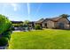Lush backyard featuring a large grassy area and beautiful landscaping at 17673 E Bronco Dr, Queen Creek, AZ 85142