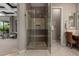 Modern shower featuring gray tile, seating and modern fixtures in a bright bathroom at 17673 E Bronco Dr, Queen Creek, AZ 85142