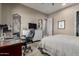 Bedroom featuring a neutral color scheme, ceiling fan, desk and adjacent closet at 17673 E Bronco Dr, Queen Creek, AZ 85142