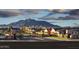 Scenic community view showcasing well-maintained homes and mountain backdrop at 17673 E Bronco Dr, Queen Creek, AZ 85142