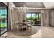 Charming dining area with outdoor view, stylish chandelier, and inviting atmosphere at 17673 E Bronco Dr, Queen Creek, AZ 85142