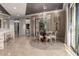 Bright dining area with stylish chandelier and seamless flow to the rest of the home at 17673 E Bronco Dr, Queen Creek, AZ 85142